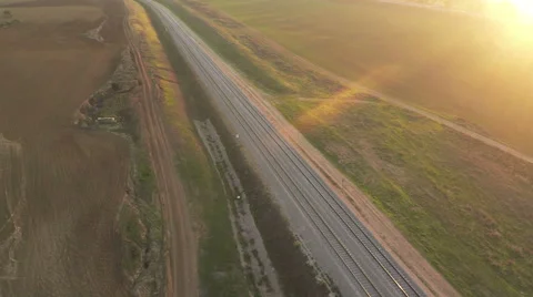 Aerial view of train track at sunset Stock Footage 58614509