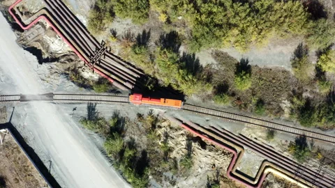 Aerial View of a Train on Tracks Amidst Beautiful Nature and Greenery, Showing Vidéo 284764398