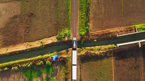 Aerial view of train on tracks at Lake Rawa Pening, Indonesia. Stock Footage 342479018