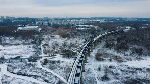 Aerial view train with wagons moving along the overpass Video stock 227400106