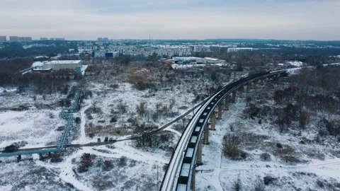 Aerial view train with wagons moving along the overpass Video stock 227400289