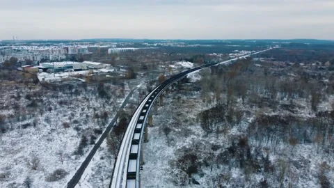 Aerial view train with wagons moving along the overpass Video stock 227400471