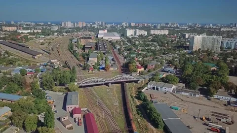 Aerial view of the train which approaches the station in the industrial district Stock Footage 80878791