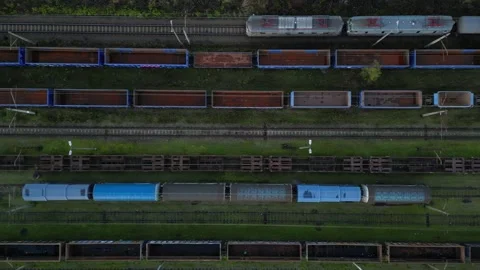 Aerial view of train yard showcasing multiple freight cars and locomotives Stock Footage 321420435