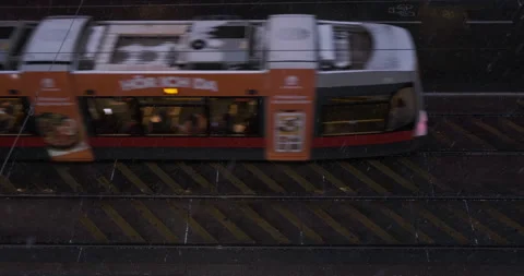 Aerial view of trams in Vienna at night. Winter, snow falling, road markings. Video stock 226434158