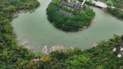 Aerial view of trang an with tourists exploring the river on traditional bo.. Video stock 335091748