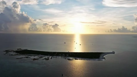 Aerial view of tranquil Alacranes Reef at sunset, Mexico. Stock Footage 284848893