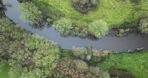 Aerial view of a tranquil river De Tatums, Hellendoorn, Overijssel, Netherlands. Stock Footage 312871139