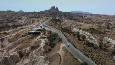 Aerial view of transfer van circulating on the roads of Capadoccia. Stock Footage 228357939