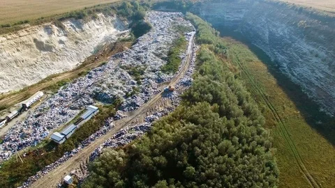 Aerial view of trash dump beetween agricultural fields. Stock Footage 81014953