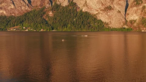 Aerial view of Traunstein mountain wall illuminated by golden sunset light Видео 344184256