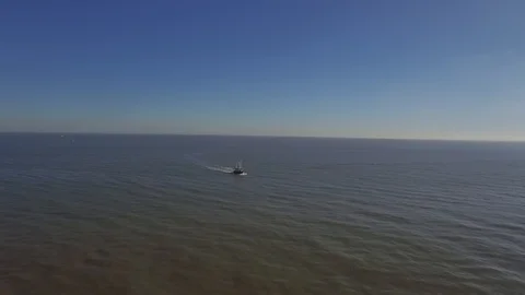Aerial view of trawler sailing on river Elbe, tilting to bird's-eye view Stock Footage 87380298