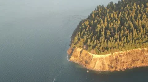Aerial View of Trees and Cliffs on Wooded Peninsula Stock Footage 10688573