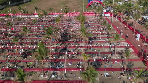 Aerial View of triathletes getting ready for the bike course at the transitio Stock Footage 156667321