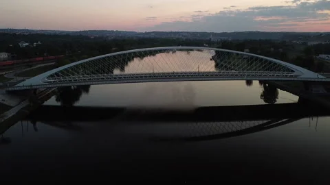 Aerial view of the Troja Bridge after sunset above the Vltava river Stock Footage 161109247