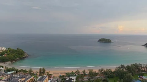 Aerial view of tropical beach with calm waters and distant island scenery Stock-Footage 342331990