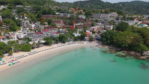Aerial view of tropical beach with clear water and resort buildings nearby Video stock 342332355
