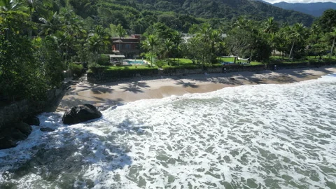 Aerial view of tropical beach waves and rainforest coastline in Brazil Stock Footage 334556653