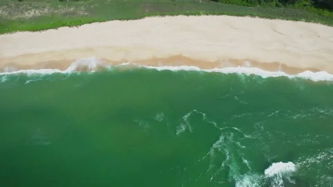 Aerial View of Tropical Sandy Beach with Green Ocean Waves Rolling onto Shore Stock Footage 342096364