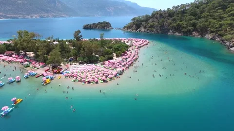 Aerial view of tropical summer beach vacation with shallow lagoon bay - Blue Sea Stock Footage 339366176