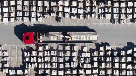 Aerial view of truck crane loading concrete slabs in industrial area 스톡 동영상 333390351