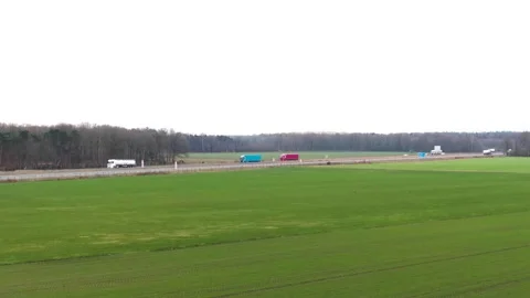 Aerial view of trucks driving on the highway Stock Footage 240388127