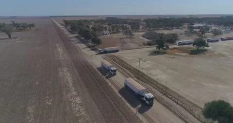 Aerial view of trucks prepared to load corn grains after harvest in the Stock Footage 158909676
