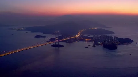 Aerial view of Tsing Ma Bridge, longest bridge in Hong Kong, evening, sunst. Video stock 144582020