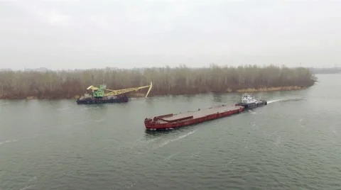 Aerial view of tug boat pushing empty barge Stock Footage 58505732