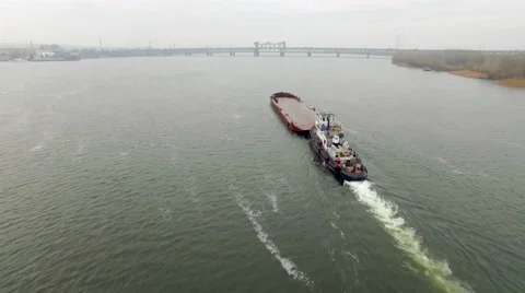 Aerial view of tug boat pushing empty barge Stock Footage 58506072