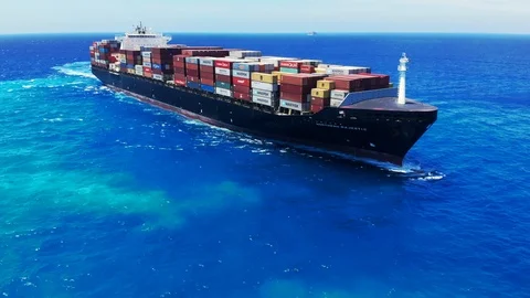 Aerial View of Tugboat and Container Cargo Ship Near Freeport Harbor, Bahamas Stock Footage 107638574