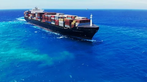 Aerial View of Tugboat and Container Cargo Ship Near Freeport Harbor, Bahamas Stock Footage 107638605