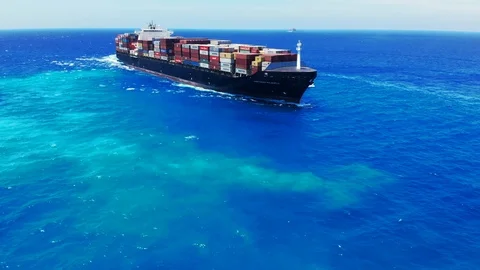 Aerial View of Tugboat and Container Cargo Ship Near Freeport Harbor, Bahamas Stock Footage 107638871