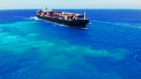 Aerial View of Tugboat and Container Cargo Ship Near Freeport Harbor, Bahamas Stock Footage 107638985