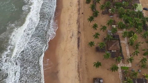 Aerial view of turquoise Atlantic waves and sandy coastline in Lome, Togo Stock Footage 330972881