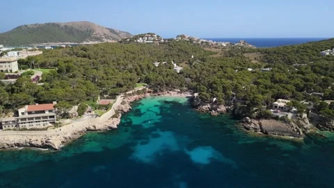 Aerial view of turquoise bay on Mallorca coastline with clear water, Cala Gat Stock Footage 284875201