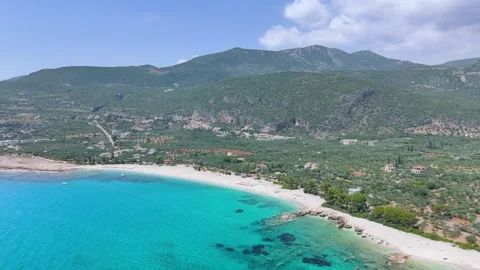 Aerial View of Turquoise Beach and Mountains near Kardamyli Stock Footage 335644130