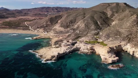 Aerial View of Turquoise Coastal Cliffs, Playazo de Rodalquilar, Almeria Stock Footage 333310748