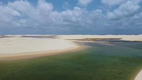 Aerial view of the turquoise lagoon in Lencois Maranhenses, Brazil Stock Footage 169754663