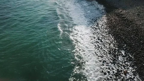 Aerial view of turquoise ocean waves reaching the shore.Summer vacation holidays Stock Footage 95716063