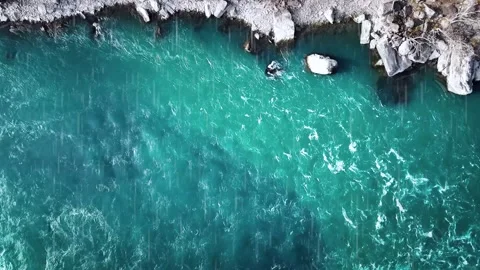 Aerial View of Turquoise Ocean Waves Along Rocky Coastline Stock Footage 337027195