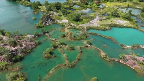 Aerial view of turquoise water pools and greenery Vídeos de archivo 344826093