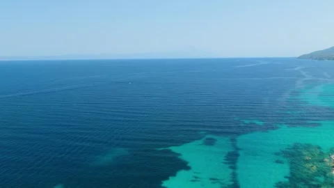 Aerial view of the turquoise waters and rocky coastline near Vourvourou and Stock Footage 346670384