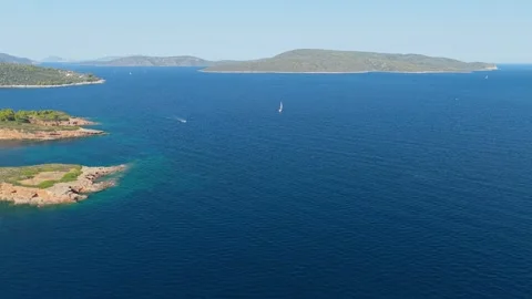 Aerial view of the turquoise waters and rocky coastline of Kokkinokastro Beach Stock Footage 346677006