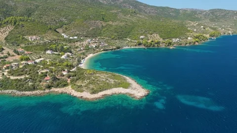 Aerial view of the turquoise waters and natural coastline of Glifa Beach at Stock Footage 346691259