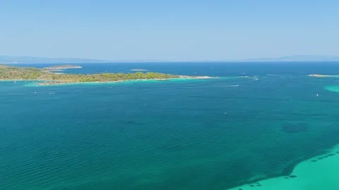 Aerial view of the turquoise waters and lush green coastline of Vourvourou and Stock Footage 346703357