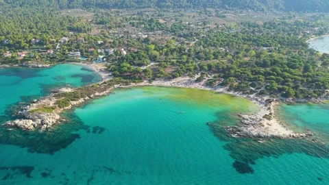 Aerial view of the turquoise waters, sandy coves, and lush pine forests of Stock Footage 346676858