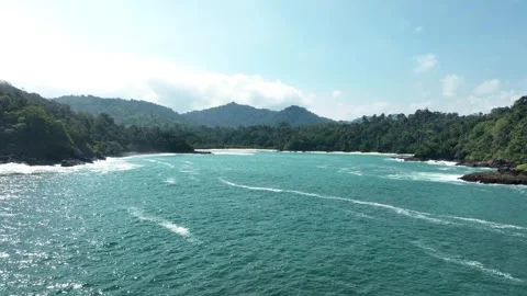 Aerial View of Turquoise Waves and Lush Coastline Near Green Island, Southern Stock Footage 335283345