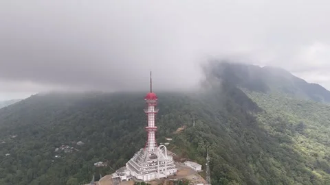 Aerial view of the Turyapada Tower surrounded by mist and clouds Stock Footage 316193994