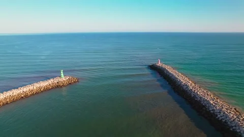Aerial view of two beautiful stone Lighthouses as harbours in 4k. Stock Footage 163374429